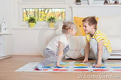 Two happy children playing exciting game at home Stock Photo