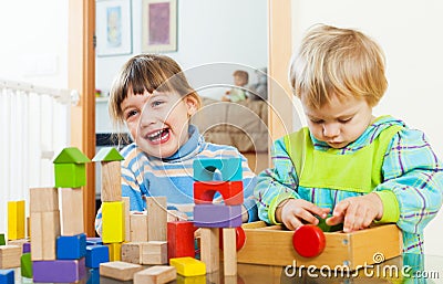 Two happy children playing in home Stock Photo