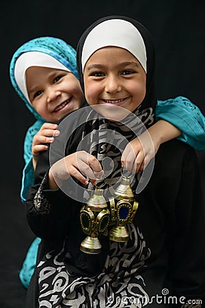 Two Happy Muslim Girls with Ramadan Lantern Stock Photo