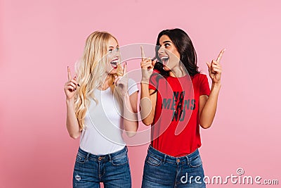 Two happy screaming women showing size of something Stock Photo