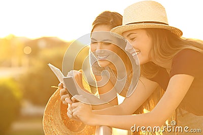 Tourists planning vacations in an hotel balcony Stock Photo