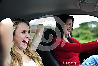Two happy women in a car Stock Photo
