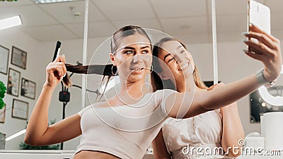 Women take a selfie in a beauty salon Stock Photo
