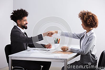 Two Businesspeople Shaking Hands Stock Photo