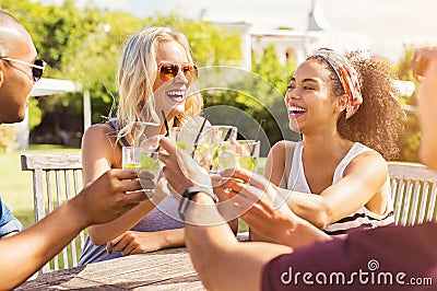 Friends toasting with cocktails Stock Photo