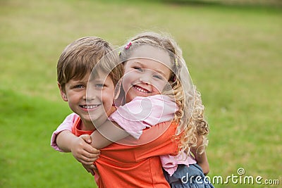 Two happy young kids playing at park Stock Photo