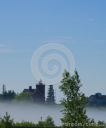 Two Harbors Lighthouse in Morning Mist Stock Photo