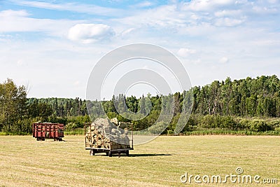 Two Hay Wagons in a Farm Field Stock Photo