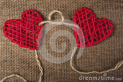 Two Hearts on burlap Background. Wedding Love Concept Stock Photo