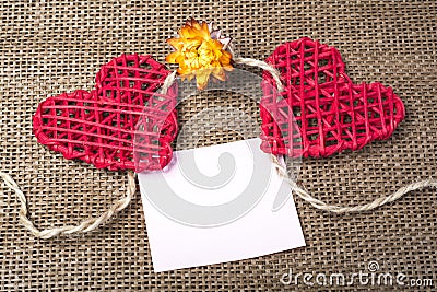 Two Hearts on burlap Background. Wedding Love Concept Stock Photo