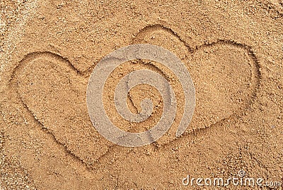 Two hearts drawn in the sand Stock Photo