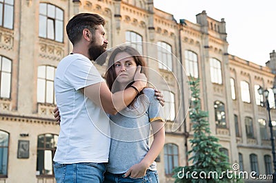 Two hearts full of love. Sensual couple in love with building on background. Bearded man hugging adorable woman with Stock Photo