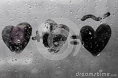 Two hearts with plus sing and equality sign on window in Rainy weather , valentine`s day Stock Photo