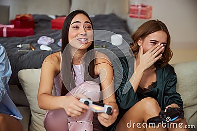 Two high-spirited players enjoying a video game Stock Photo