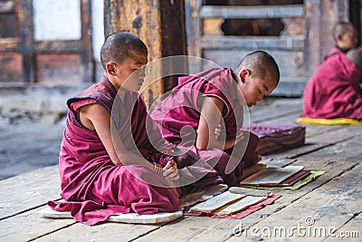 Two Himalayan Bhutanese young novice monks chanting , Bhutan Editorial Stock Photo