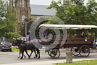 Two horse carriage with tourists in Charlottetown in Canada Editorial Stock Photo