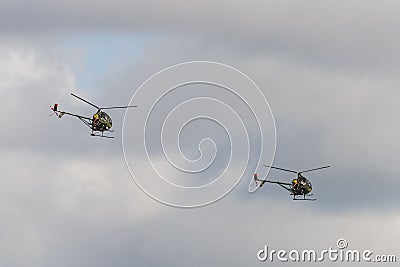 Two Hughes 269 military helicopters Editorial Stock Photo