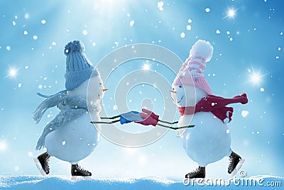 Two ice skating snowmen Stock Photo