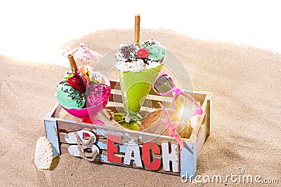 Two Icecreams in a box on the beach Stock Photo