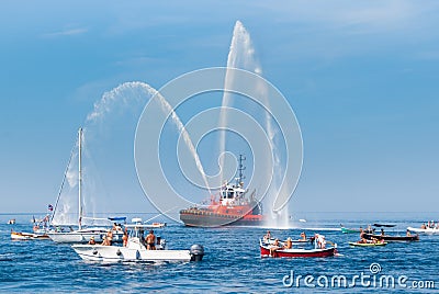 Fire brigade ship with high splashes to the sky Stock Photo