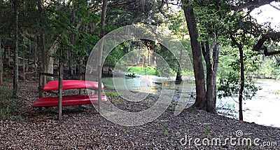 Two Red Kayaks by a Secluded Lake Stock Photo