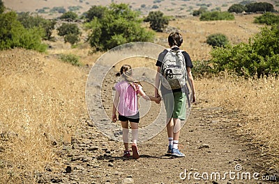 Two kids hiking at park Stock Photo