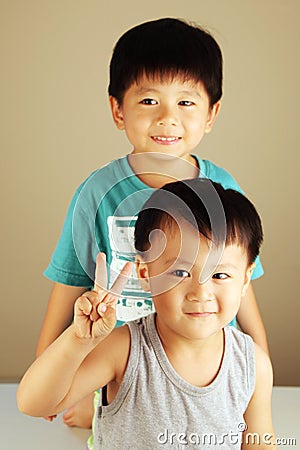 Two kids looking to the side Stock Photo