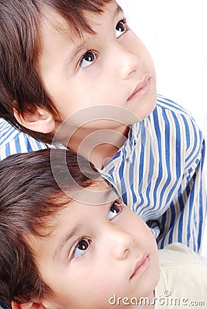 Two kids looking up Stock Photo