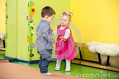 Two kids in Montessori preschool Class. girl and boy playing in kindergarten Stock Photo