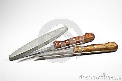 Two kitchen knife and a whetstone Stock Photo