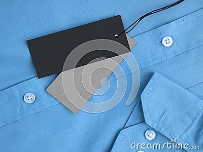 Two label price tags mock-up on blue shirt. Stock Photo