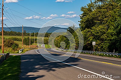 A two lane road going downhill in Sharpsburg, Maryland, USA Stock Photo