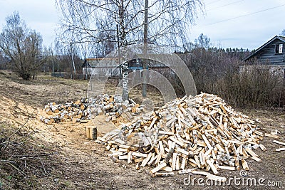 Two large piles of birch firewood. Stock Photo