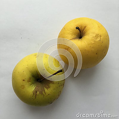 Two large ripe apples on a white background. Abstract still life. Stock Photo