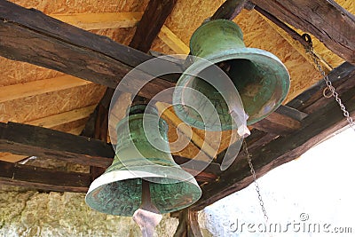 Two large rusty church bells in the bell tower of an old cave church Editorial Stock Photo