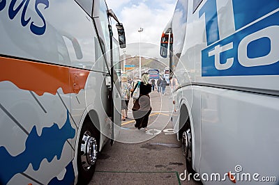 Two large tourist buses brought tourists on a tour and are parked Editorial Stock Photo