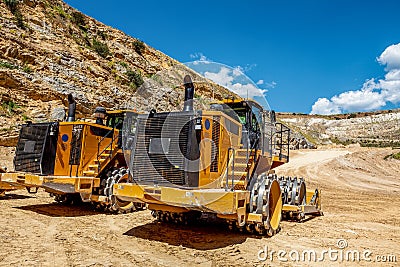 Two large yellow industrial bulldozers. Stock Photo