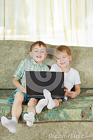 Two laughing boys with notebook Stock Photo