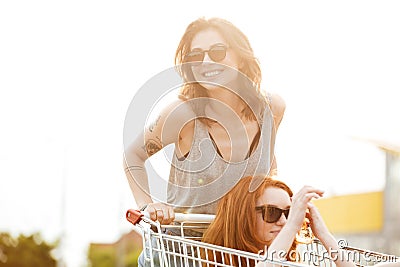 Two laughing crazy women in sunglasses having fun Stock Photo