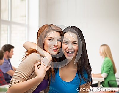 Two laughing girls hugging Stock Photo