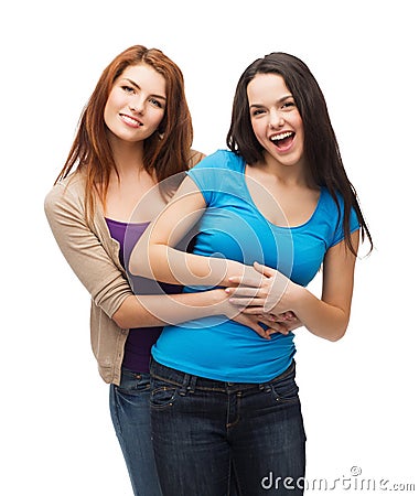 Two laughing girls hugging Stock Photo