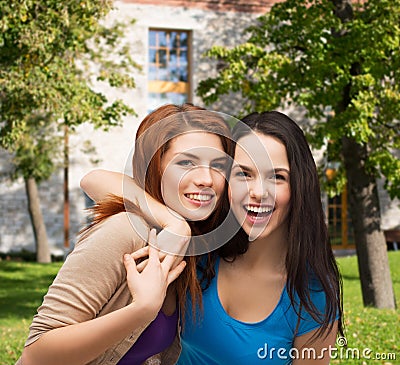 Two laughing girls hugging Stock Photo