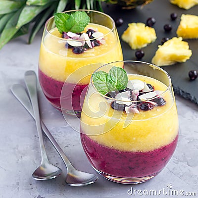 Two layer smoothie with black currant, quick oats, yogurt and pineapple, banana, square Stock Photo