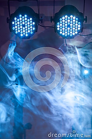 Two led blue concert and nightclub lights with smoke Stock Photo
