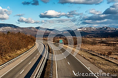 Two line wide highway curve on a summer day Stock Photo