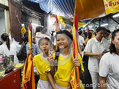 Two littel girl in yellow shirt hold flag Editorial Stock Photo