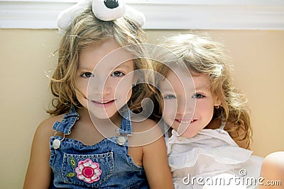 Two little beautiful toddler twin sisters Stock Photo