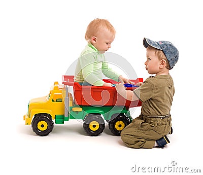 Two little boys play with toy truck Stock Photo