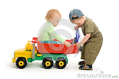 Two little boys play with toy truck Stock Photo