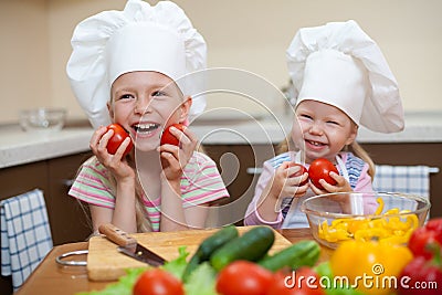 Two little girls preparing healthy food on kitchen Stock Photo